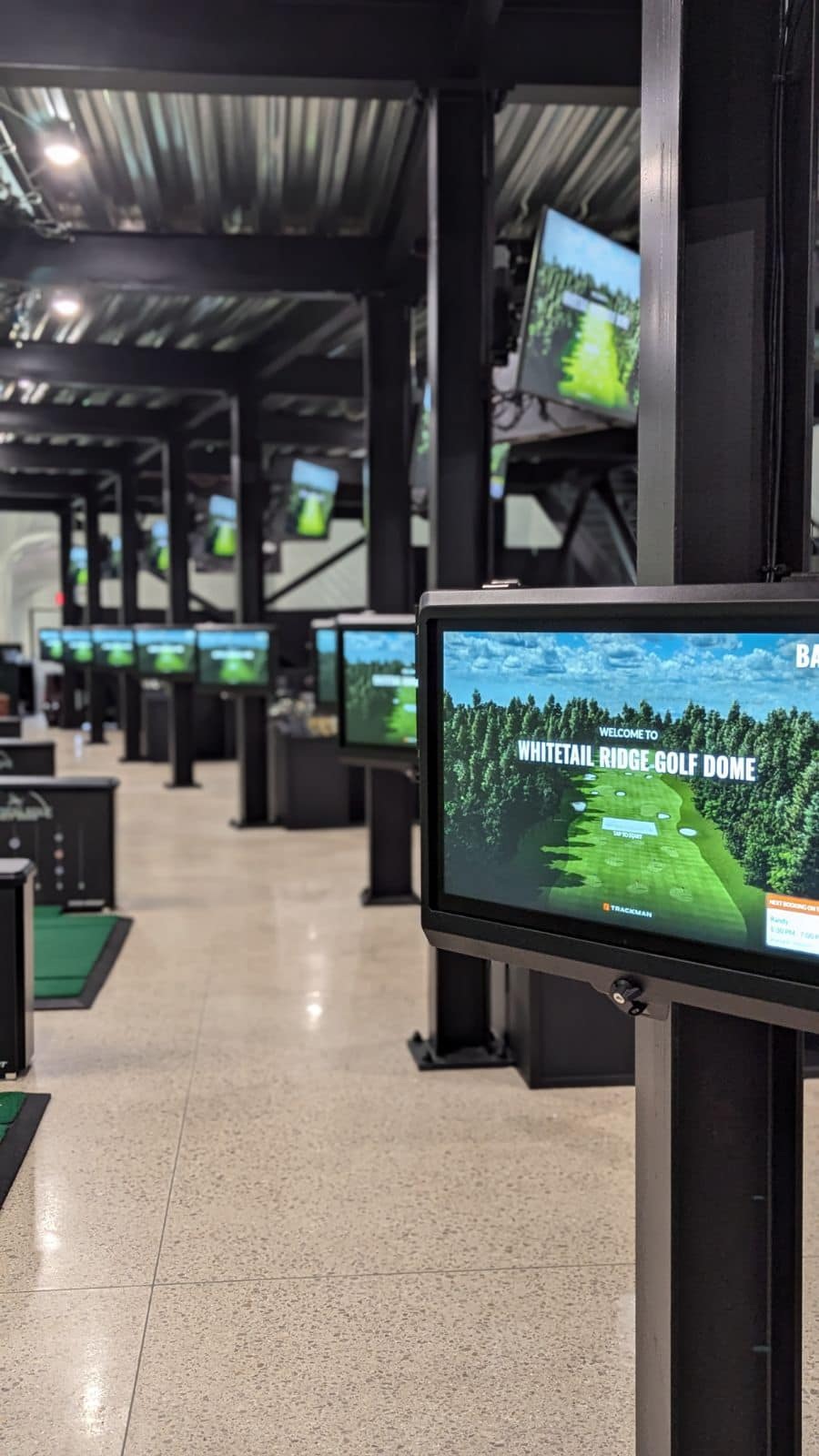View of the bay screens at the indoor driving range at Whitetail Ridge Dome